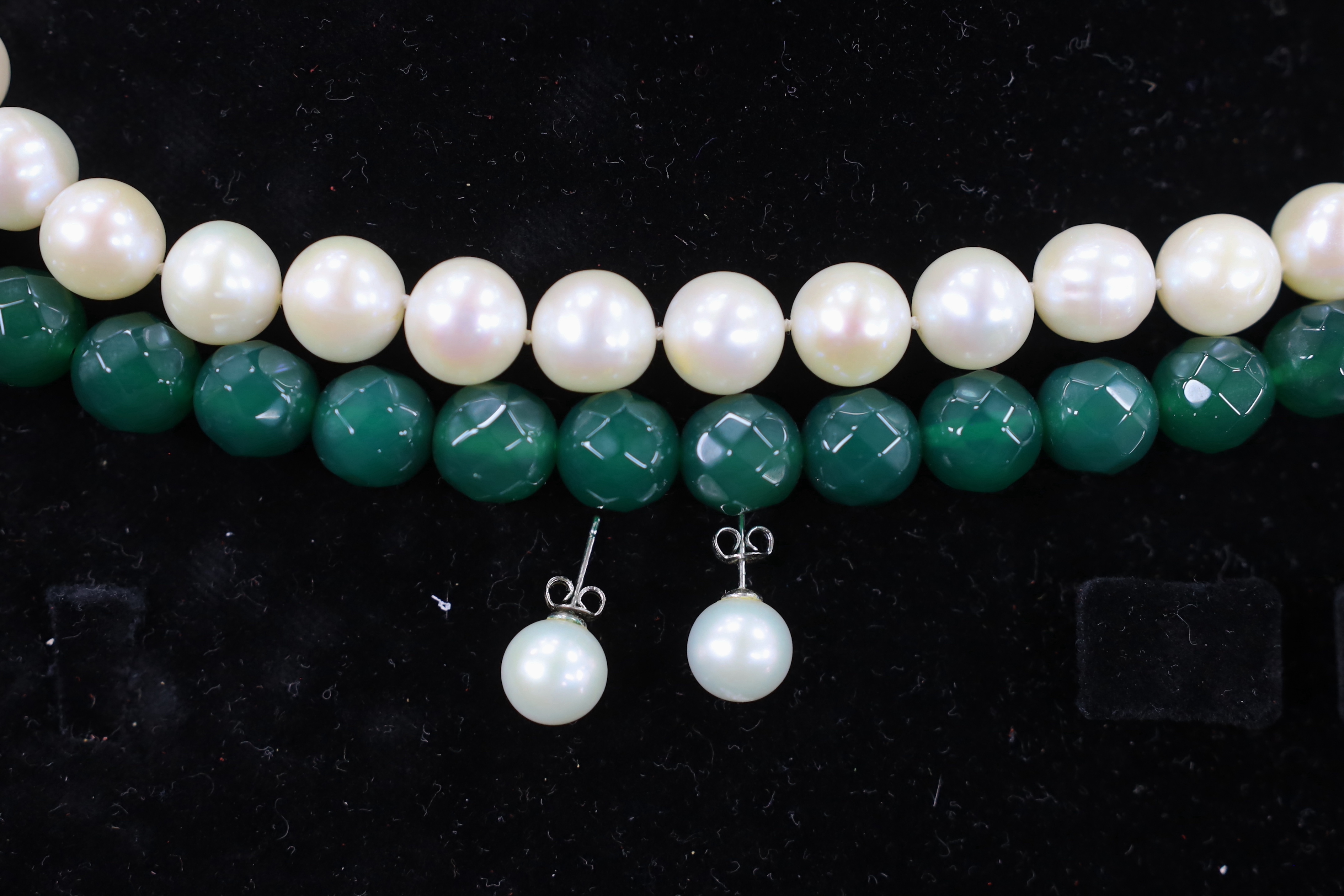 A modern Middle Eastern single strand cultured pearl necklace, with white metal clasp, 42cm, a similar pair of 925 mounted cultured pearl earrings and a facetted chrysoprase? bead necklace.